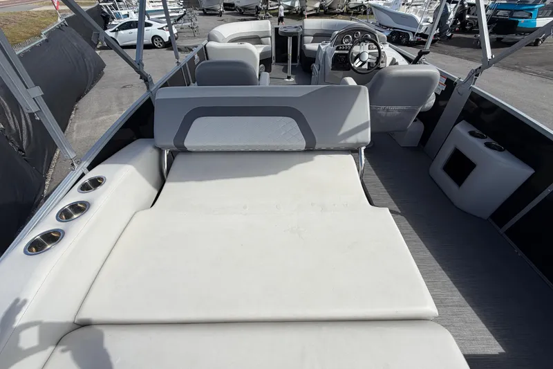 Slide: The Image of 2023 Lowe SS 210 boat interior with seating and steering wheel, showcasing modern design. - 15
