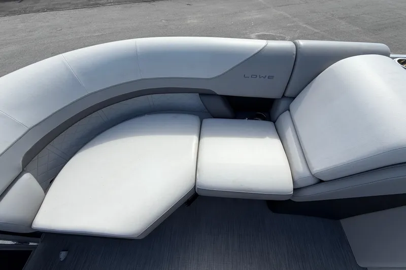 Slide: The Image of 2023 Lowe SS 210 boat interior with plush white seating and modern design. - 29