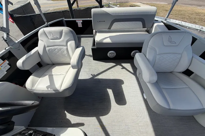 Slide: The Image of 2023 Lowe SS 210 boat interior with plush seating and modern design. - 40