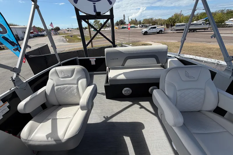 Slide: The Image of 2023 Lowe SS 210 boat interior with plush seating and modern design. - 41