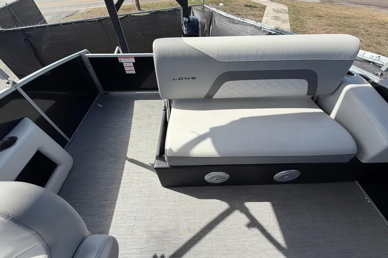 Slide: The Image of 2023 Lowe SS 210 boat interior with gray seating and modern design. - 42