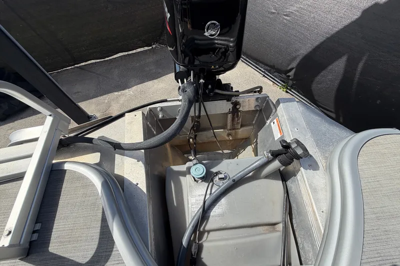 Slide: The Image of 2023 Lowe SS 210 boat engine and fuel tank setup, showcasing seating and controls. - 45