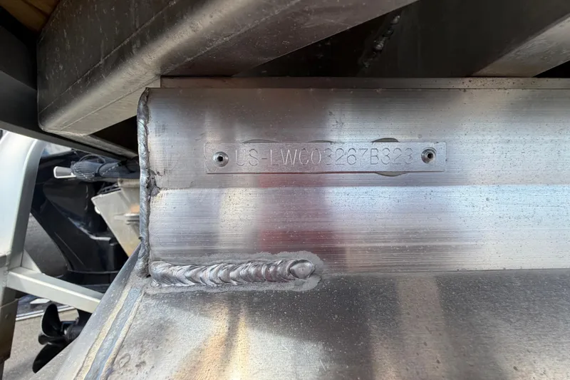 Slide: The Image of 2023 Lowe SS 210 boat hull identification number with visible welding details. - 47