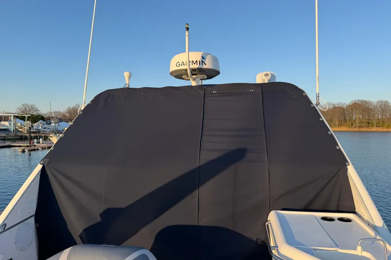 Slide: The Image of 1999 Bayliner 4788 Pilot House Motoryacht with Garmin radar, docked on a sunny day. - 11