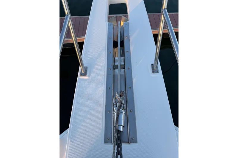 Slide: The Image of Bow view of 1999 Bayliner 4788 Pilot House Motoryacht with anchor chain and railings. - 13