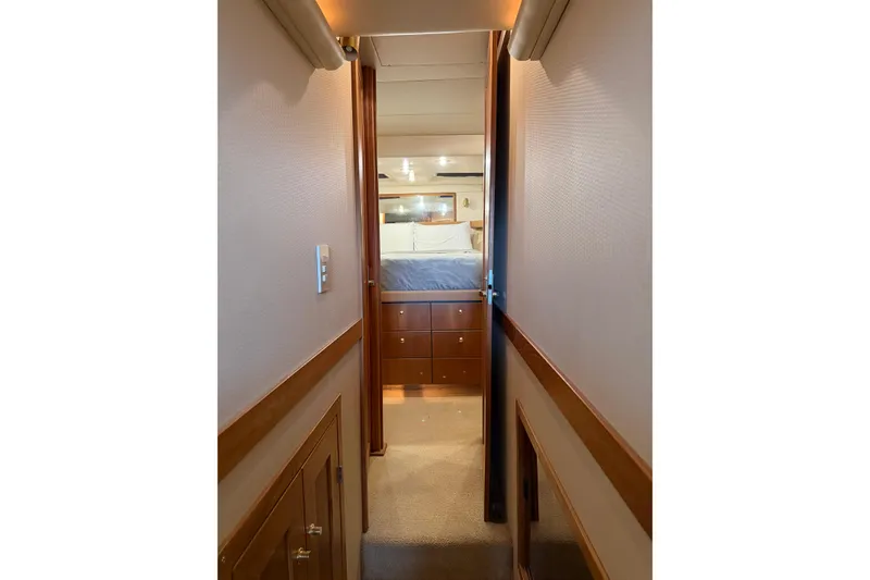Slide: The Image of Hallway leading to bedroom in 1999 Bayliner 4788 Pilot House Motoryacht. - 25
