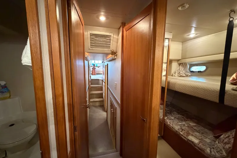 Slide: The Image of Interior hallway of 1999 Bayliner 4788 Pilot House Motoryacht with bunk beds and bathroom. - 32