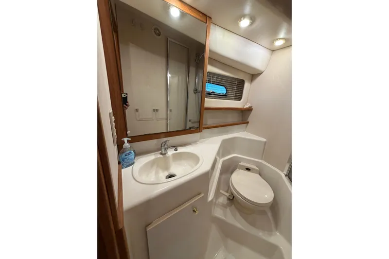 Slide: The Image of Bathroom interior of 1999 Bayliner 4788 Pilot House Motoryacht with sink and toilet. - 35