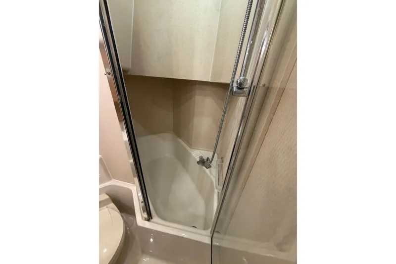 Slide: The Image of 1999 Bayliner 4788 Pilot House Motoryacht bathroom with shower and toilet. - 36