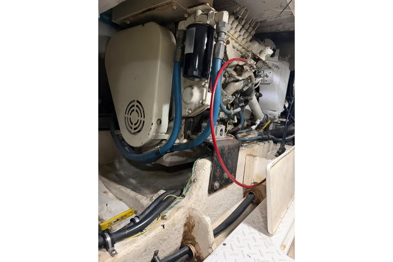 Slide: The Image of Engine compartment of a 1999 Bayliner 4788 Pilot House Motoryacht, showing mechanical components. - 40