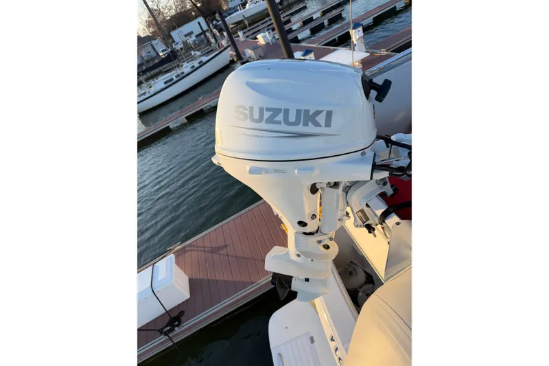 Slide: The Image of Suzuki outboard motor on a 1999 Bayliner 4788 Pilot House Motoryacht at dock. - 7