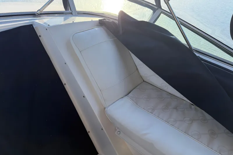 Slide: The Image of Interior seating of 1999 Bayliner 4788 Pilot House Motoryacht with white upholstery. - 8