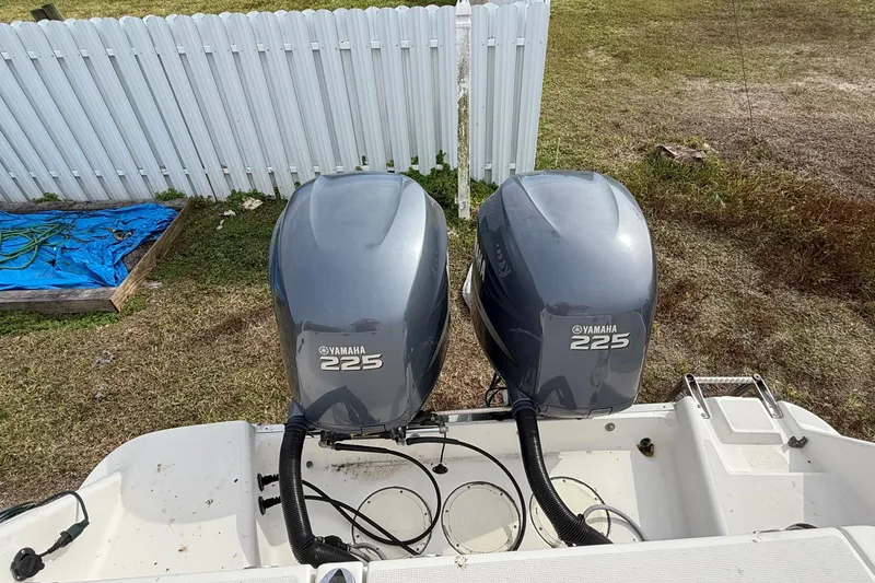 Slide: The Image of Twin Yamaha 225 engines on a 2004 Rabalo 265 boat, viewed from above. - 13