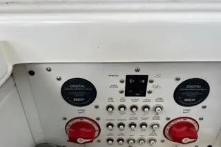 Slide: The Image of 2023 Four Winns H350 OB control panel with digital displays and switches. - 32
