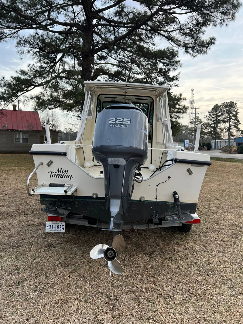 Slide: The Image of 1997 May-Craft 2300 Pilot boat on trailer, blue sky. - 4