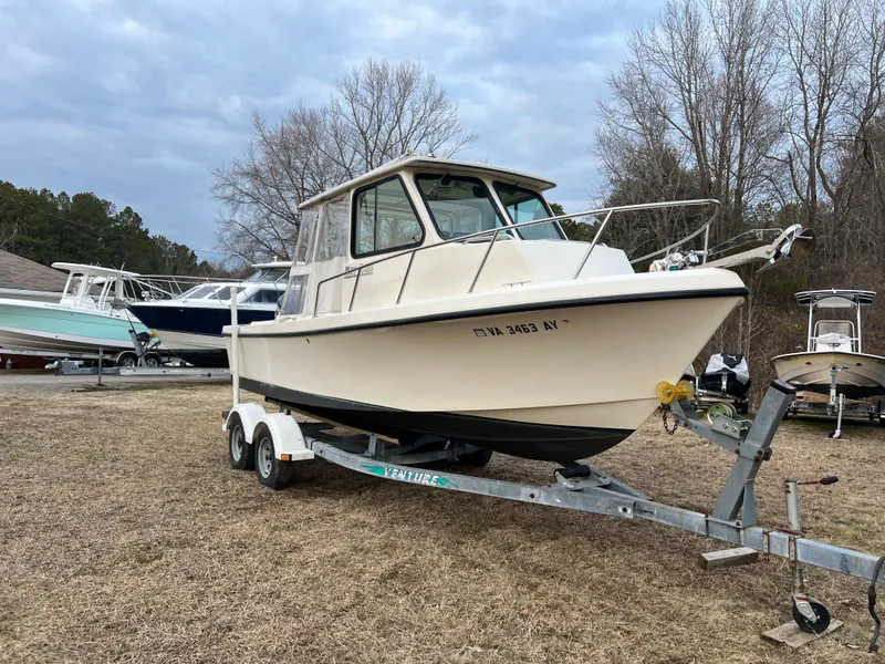 Slide: The Image of 1997 May-Craft 2300 Pilot on trailer, sunny day. - 7
