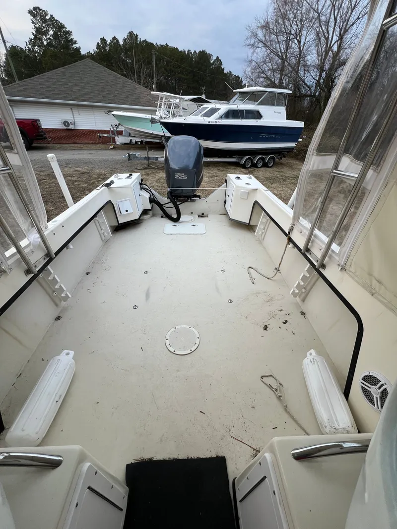 Slide: The Image of 1997 May-Craft 2300 Pilot boat with outboard motor. - 8