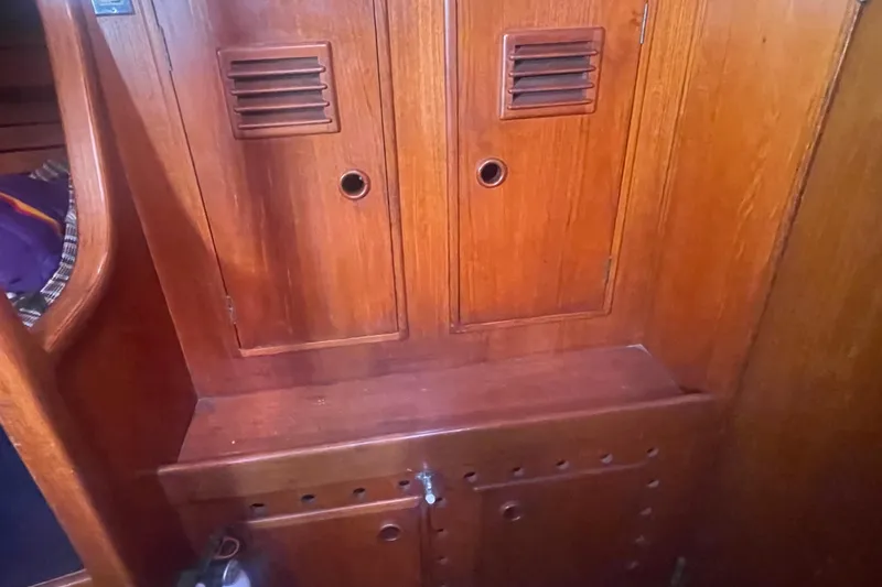 Slide: The Image of Interior wooden cabinetry of a 1981 Nautor Swan cutter sailboat. - 19