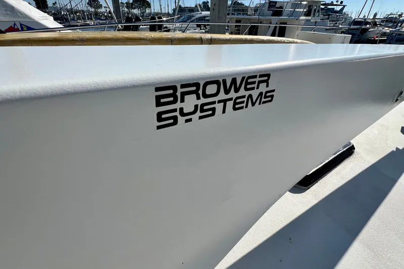 Slide: The Image of Bertram 46 Convertible 1982 boat with Brower Systems logo on deck. - 22