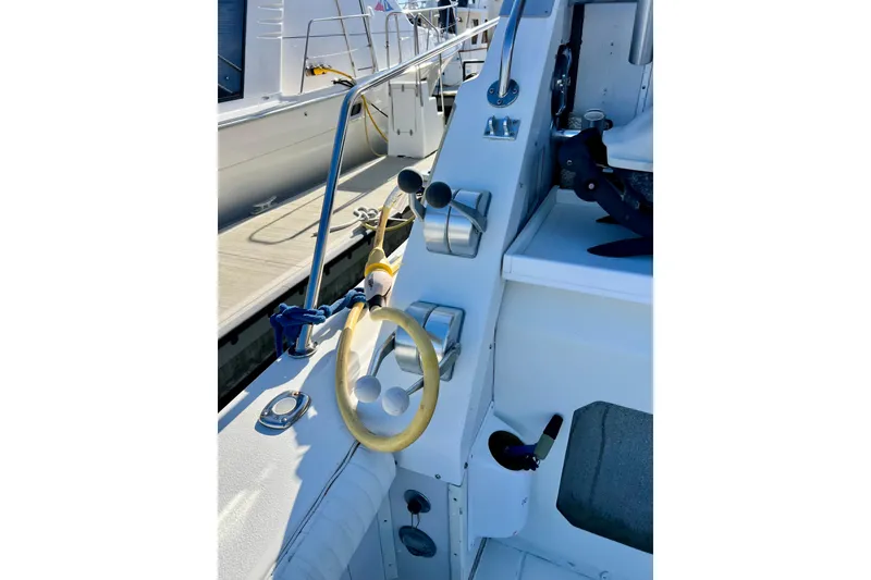 Slide: The Image of 1982 Bertram 46 Convertible yacht helm with steering wheel and controls. - 32