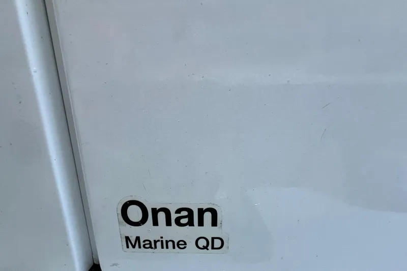 Slide: The Image of Onan Marine QD label on 1982 Bertram 46 Convertible boat surface. - 36