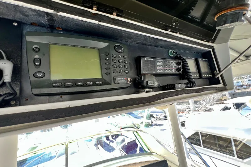 Slide: The Image of Control panel of a 1982 Bertram 46 Convertible boat with navigation equipment. - 43