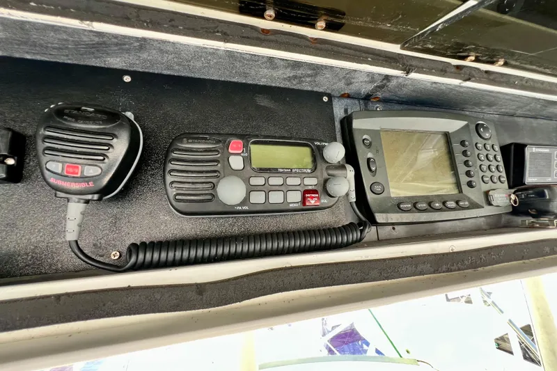 Slide: The Image of Marine electronics on a 1982 Bertram 46 Convertible, featuring radio and navigation equipment. - 44