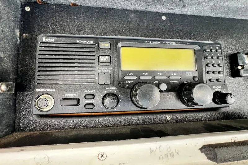 Slide: The Image of ICOM IC-M710 marine transceiver on 1982 Bertram 46 Convertible boat dashboard. - 45