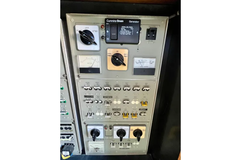 Slide: The Image of Electrical control panel on a 1982 Bertram 46 Convertible boat. - 57