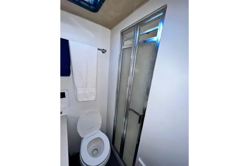 Slide: The Image of Bathroom interior of 1982 Bertram 46 Convertible yacht with shower and toilet. - 75