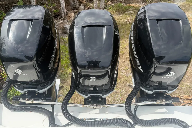 Slide: The Image of 2018 Yellowfin 36 Offshore boat speakers and rod holders under clear blue sky. - 11