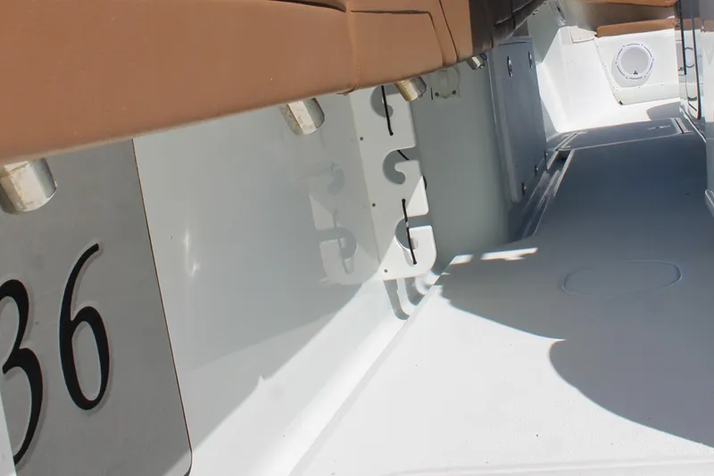 Slide: The Image of 2018 Yellowfin 36 Offshore boat interior with seating and storage features. - 13