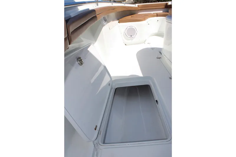 Slide: The Image of 2018 Yellowfin 36 Offshore boat interior with open storage compartment. - 15