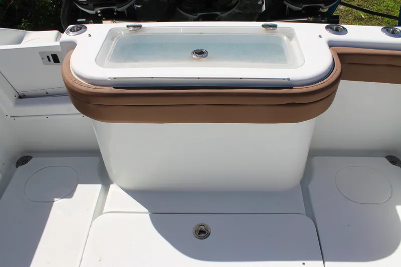 Slide: The Image of 2018 Yellowfin 36 Offshore boat deck with livewell and seating area. - 16