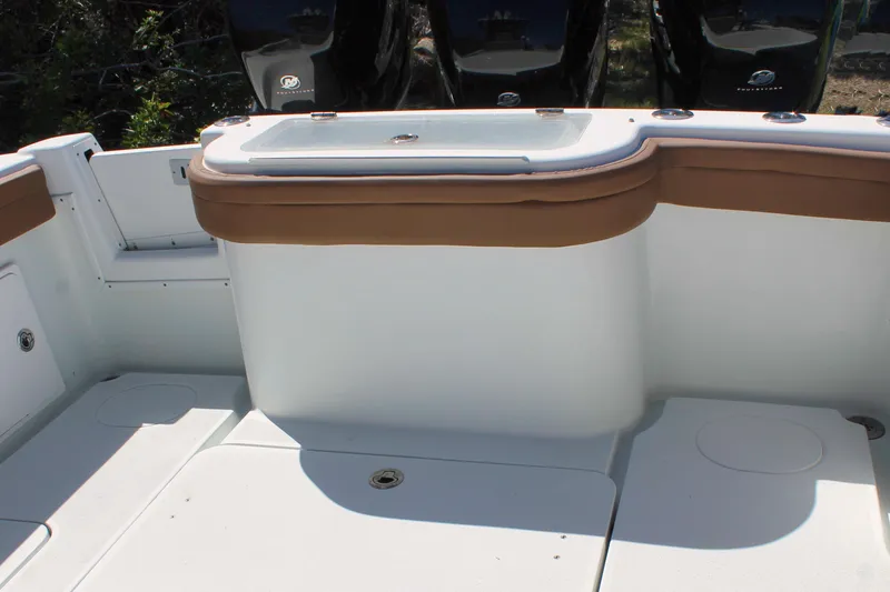 Slide: The Image of 2018 Yellowfin 36 Offshore boat interior with seating and storage compartments. - 17