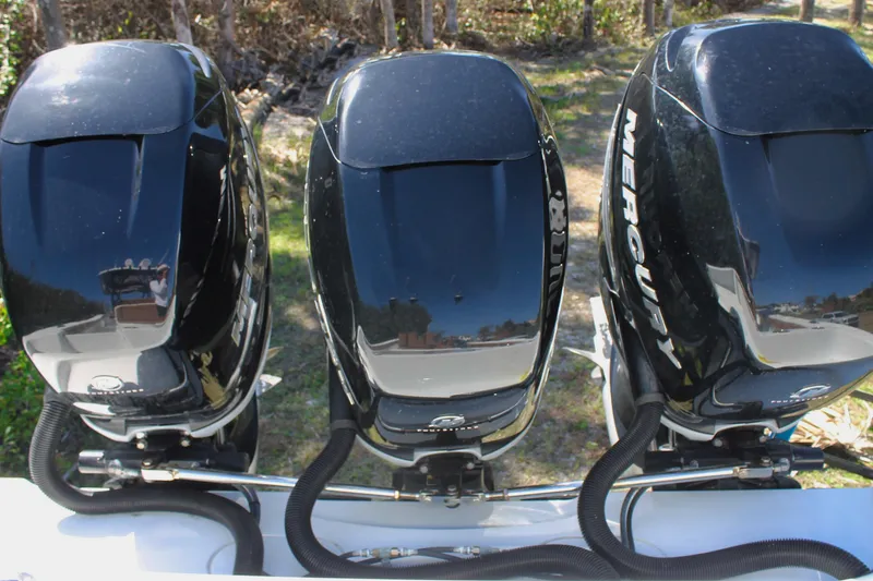 Slide: The Image of Triple Mercury outboard engines on a 2018 Yellowfin 36 Offshore boat. - 18