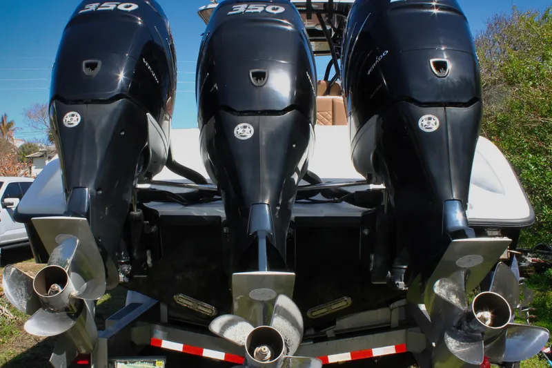 Slide: The Image of Triple outboard engines on a 2018 Yellowfin 36 Offshore boat, showcasing powerful propulsion. - 19