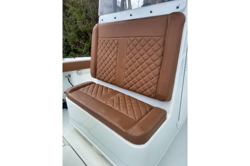 Slide: The Image of Brown quilted seat on 2018 Yellowfin 36 Offshore boat, showcasing luxury and comfort. - 4