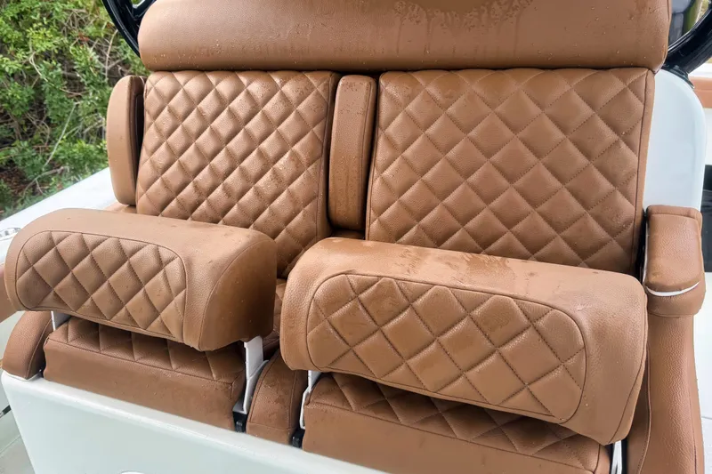 Slide: The Image of Luxurious brown leather seats on a 2018 Yellowfin 36 Offshore boat. - 5