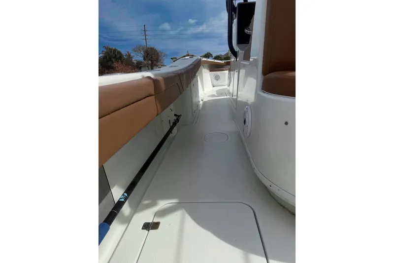 Slide: The Image of 2018 Yellowfin 36 Offshore boat dashboard with Garmin displays and steering wheel. - 7