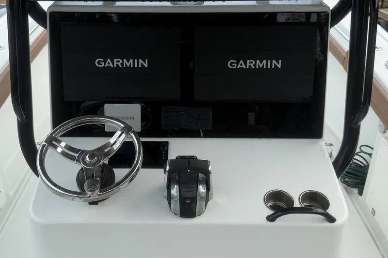 Slide: The Image of 2018 Yellowfin 36 Offshore boat with Garmin radar, surrounded by palm trees. - 8