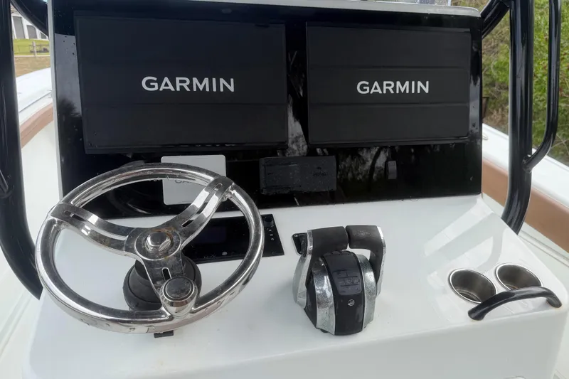 Slide: The Image of 2018 Yellowfin 36 Offshore boat interior with tan seating and fishing rod holders. - 9