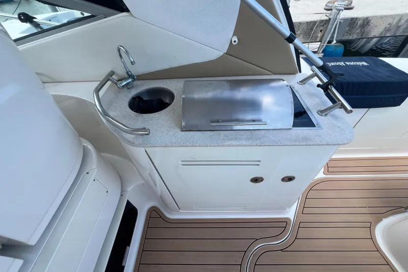 Slide: The Image of 2005 Sea Ray Sundancer 350 boat kitchenette with sink and grill on deck. - 10