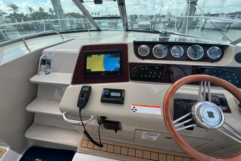 Slide: The Image of Cockpit of 2005 Sea Ray Sundancer 350 with navigation system and gauges. - 13