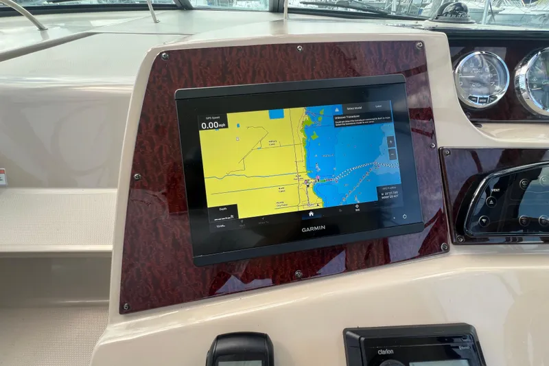 Slide: The Image of Dashboard of a 2005 Sea Ray Sundancer 350 with Garmin navigation display. - 17