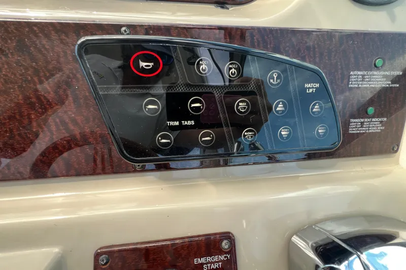 Slide: The Image of Control panel of a 2005 Sea Ray Sundancer 350 boat with various switches and indicators. - 19