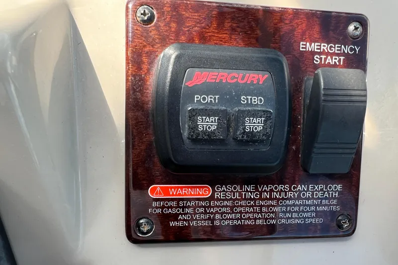 Slide: The Image of Mercury engine control panel on 2005 Sea Ray Sundancer 350 with safety warning. - 26