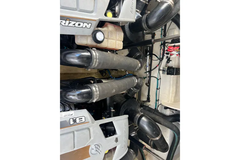 Slide: The Image of Engine compartment of a 2005 Sea Ray Sundancer 350 boat, featuring Horizon components. - 28