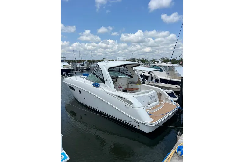 Slide: The Image of 2009 Sea Ray Sundancer 350 docked at marina under blue sky. - 30