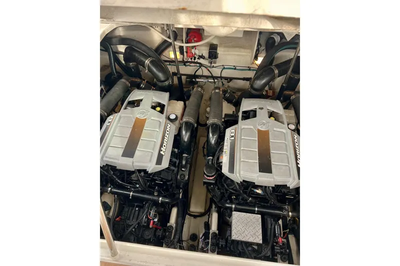 Slide: The Image of Twin engines of a 2009 Sea Ray Sundancer 350 boat, showcasing Horizon 8.1 motors. - 38